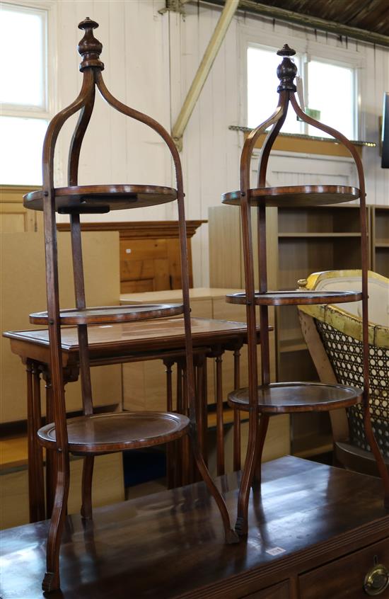 A pair of Edwardian strung mahogany three-tier cake stands, H. 3ft 1in.